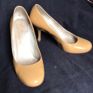 Delman round toe patent pumps